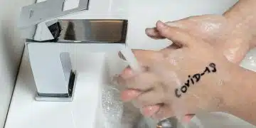 person holding white cigarette stick